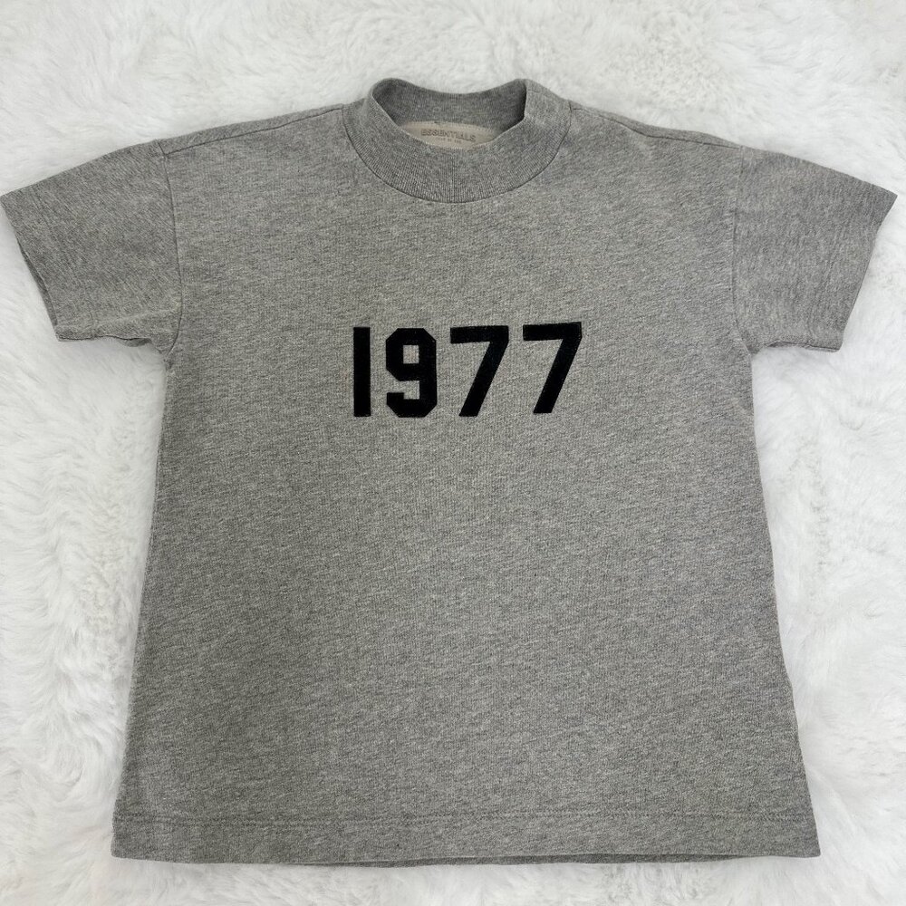Fear of God Essentials kids’ “1977” short-sleeve t-shirt in heather gray